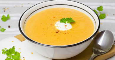 Cream of Carrot Soup - A bowl of soup on a table - Soup